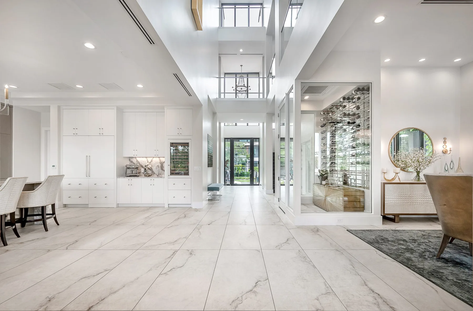 Light-filled waterfront living space with tailored seating, Harbour Island residence